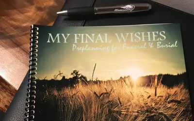 Book on table that says my final wishes preplanning for funeral and burial written on it