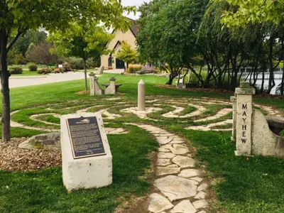 stone path leading to a winding path in the grass