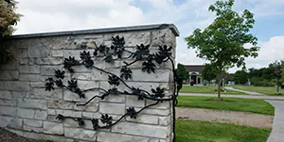 stone fence with mental floral decor